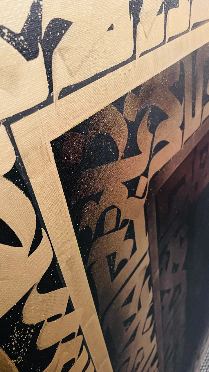 Top-left angle of ANCIENT ECHOS – highlighting the dimensional texture and metallic sheen of the gold script.