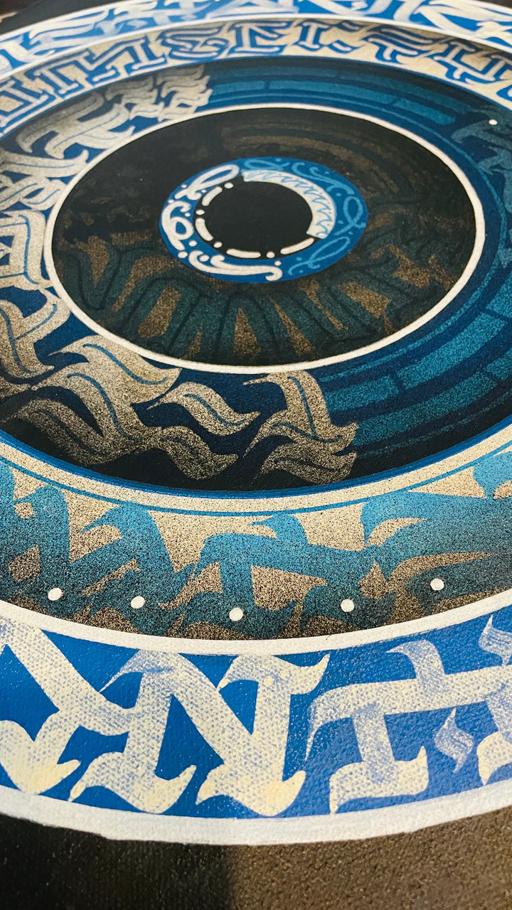 Bottom angle perspective of THE CALLI DISK – emphasizing the intricate motion and symmetry of Burnzy Art’s circular calligraphy work.