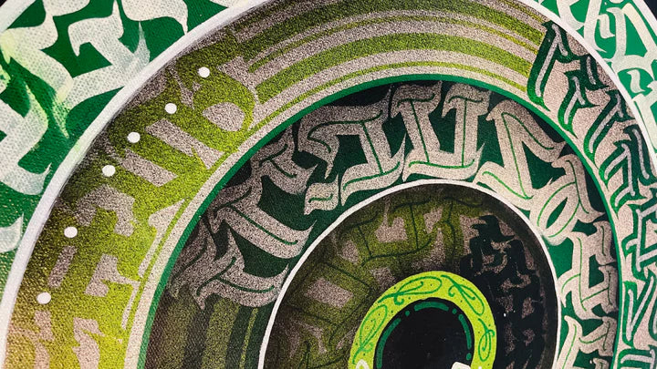 Zoomed-in top view of THE CALLI DISK – highlighting the precision and layering of calligraphic brushstrokes in green and white.