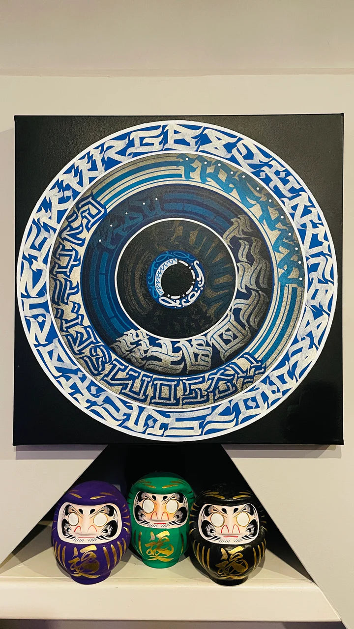 Wall-mounted view of THE CALLI DISK above a table – modern interior styling with Burnzy Art's abstract calligraffiti as a focal point.