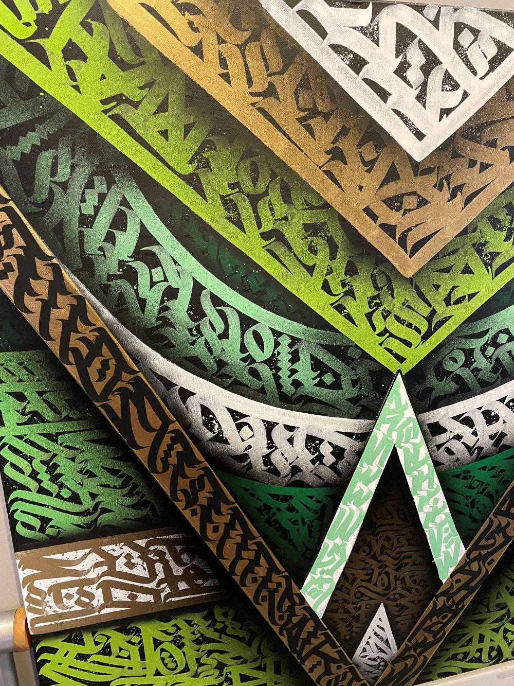Angled view showing layered brush strokes and spray paint texture on Geo Jungle artwork