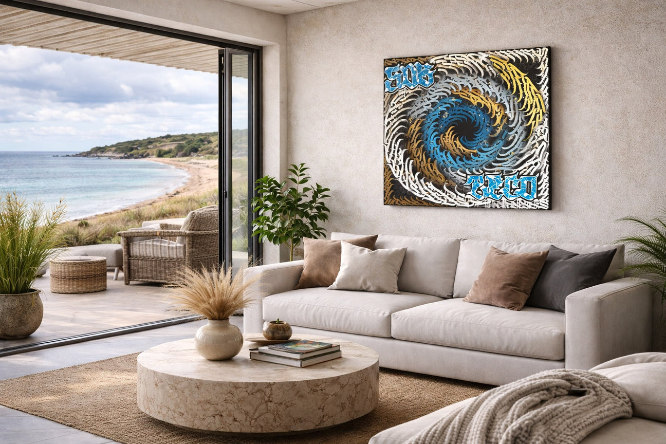 Sub Zero calligraffiti canvas wall art mockup in a luxury beachfront villa living room overlooking a British coastal beach
