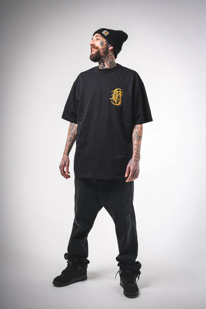Full front view of a male model wearing the Burnzy Art black T-shirt, showcasing the oversized relaxed fit.