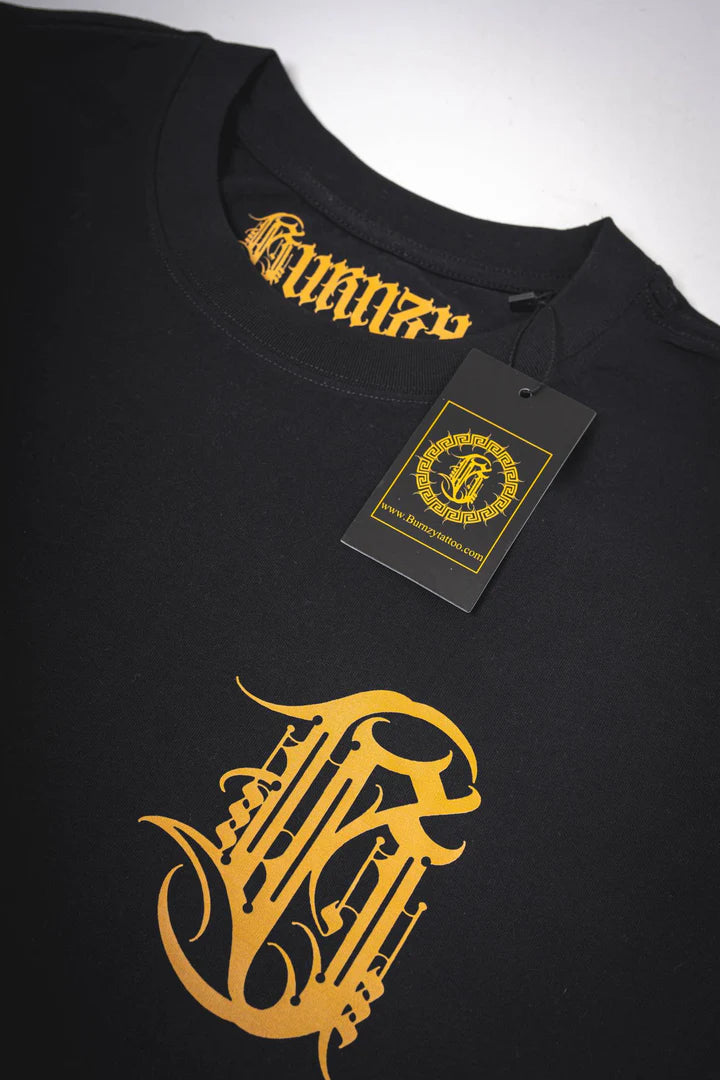 Close-up top view of the Burnzy Art oversized black T-shirt showing fabric texture and neckline stitching.