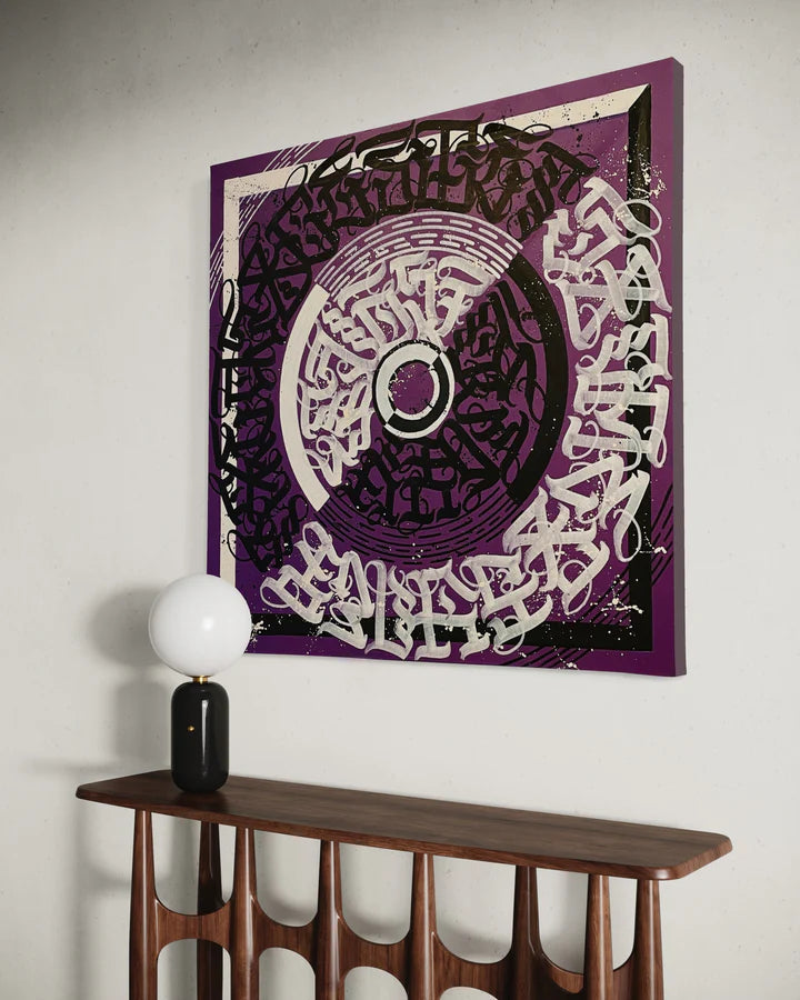 CIRCLES OF EXPRESSION PURPLE mounted on a wall – showcasing bold strokes and a rich contrast of purple tones in a modern setting.
