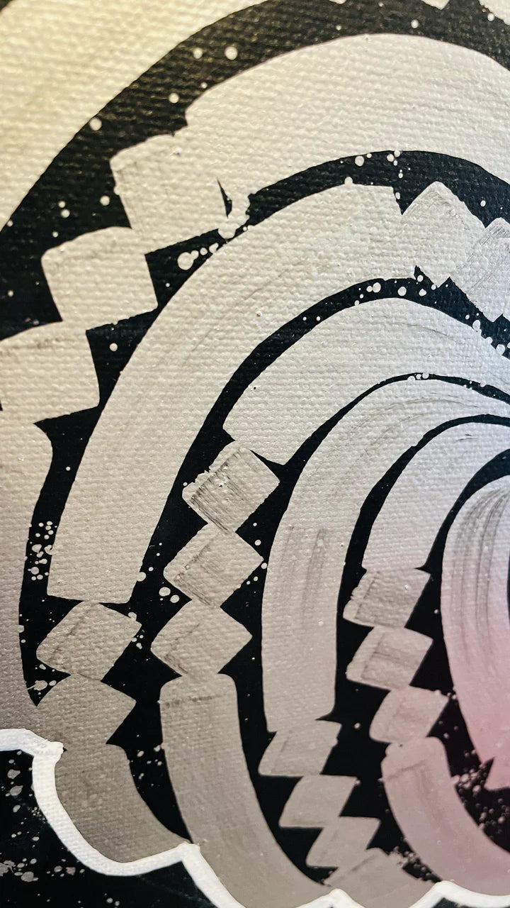 Left side angle of the white canvas, showing brush texture and calligraphic depth against a black background.