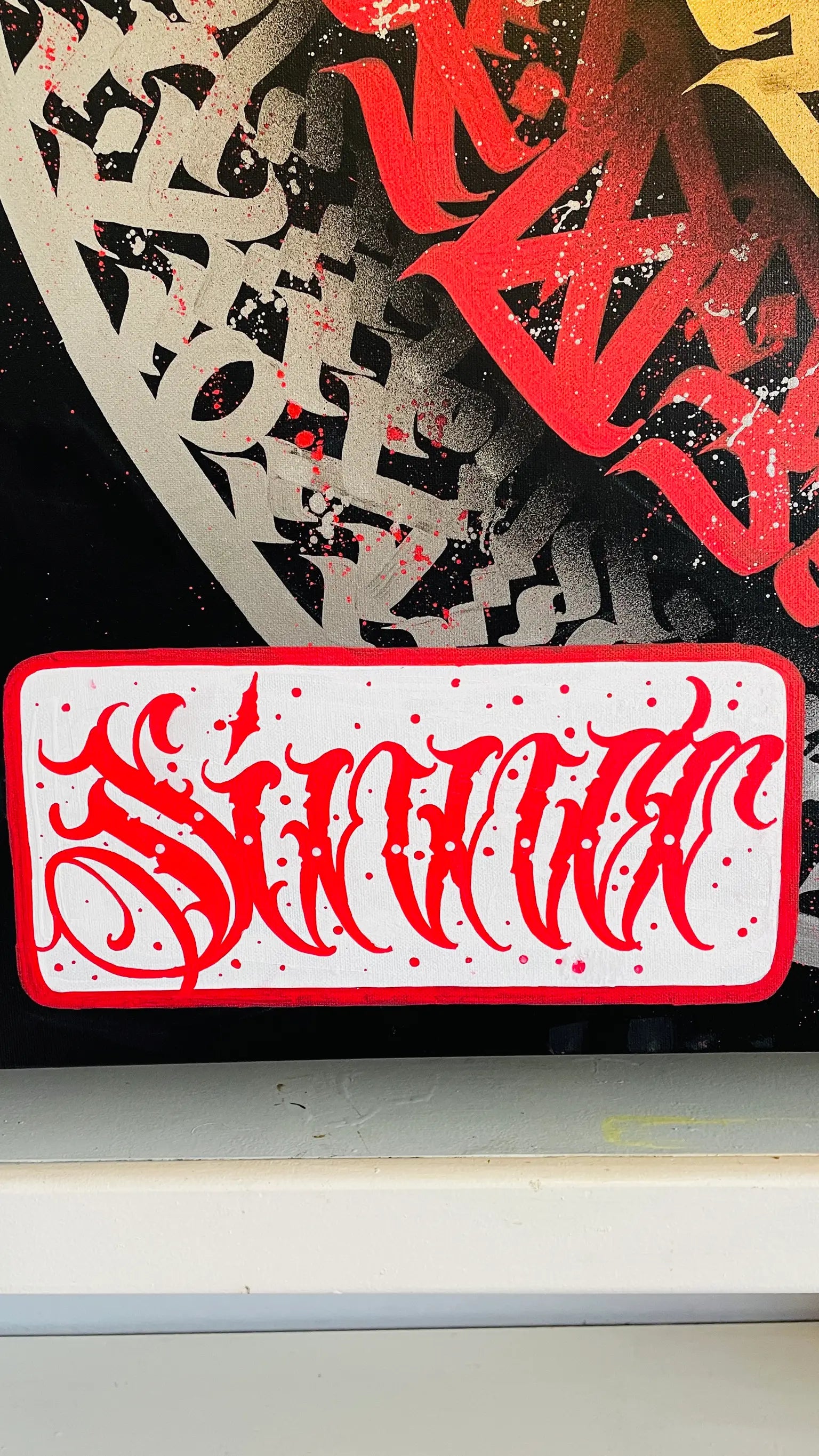 Alternate side angle of THE AKIRA – showcasing Burnzy Art’s stamp on textured canvas with vibrant layered calligraphy strokes.