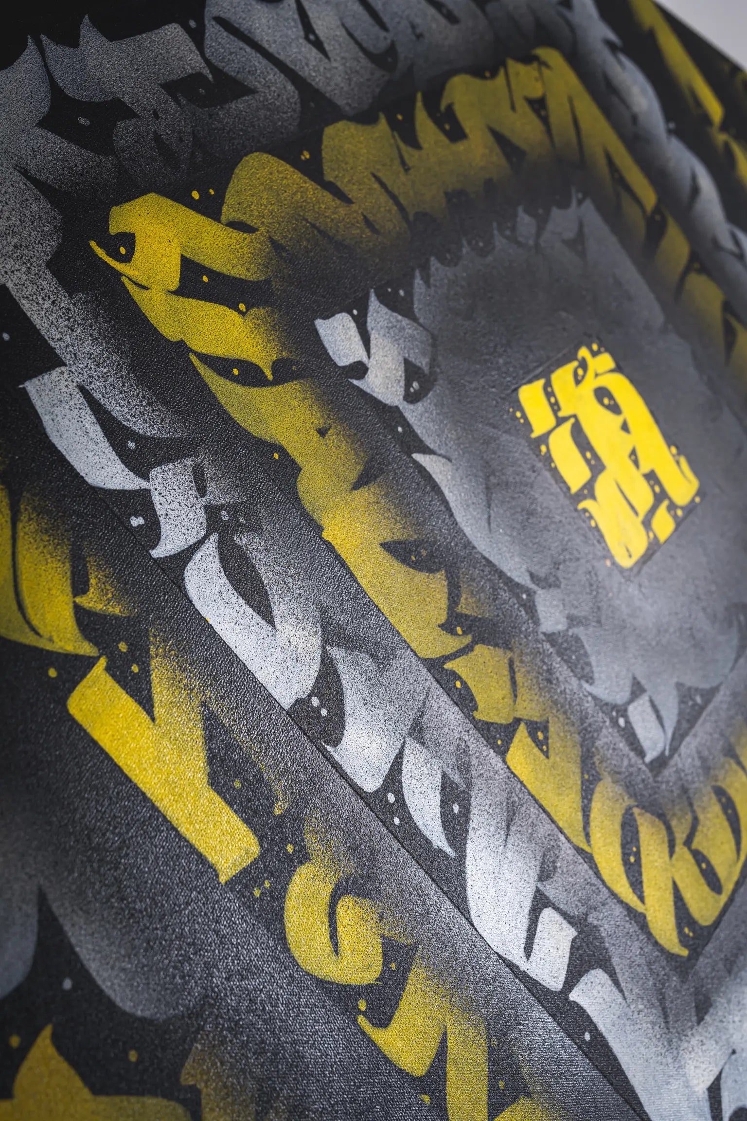 Second zoomed-in angle of THE KILLER BEE from the left – capturing layered calligraphic strokes and depth from overlapping color blocks.