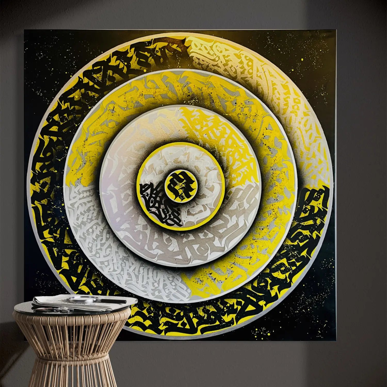 THE KILLER CALLI DISC mounted in a living room space – vibrant calligraphy art by Burnzy Art that pays tribute to bees and the natural world through bold flowing forms.