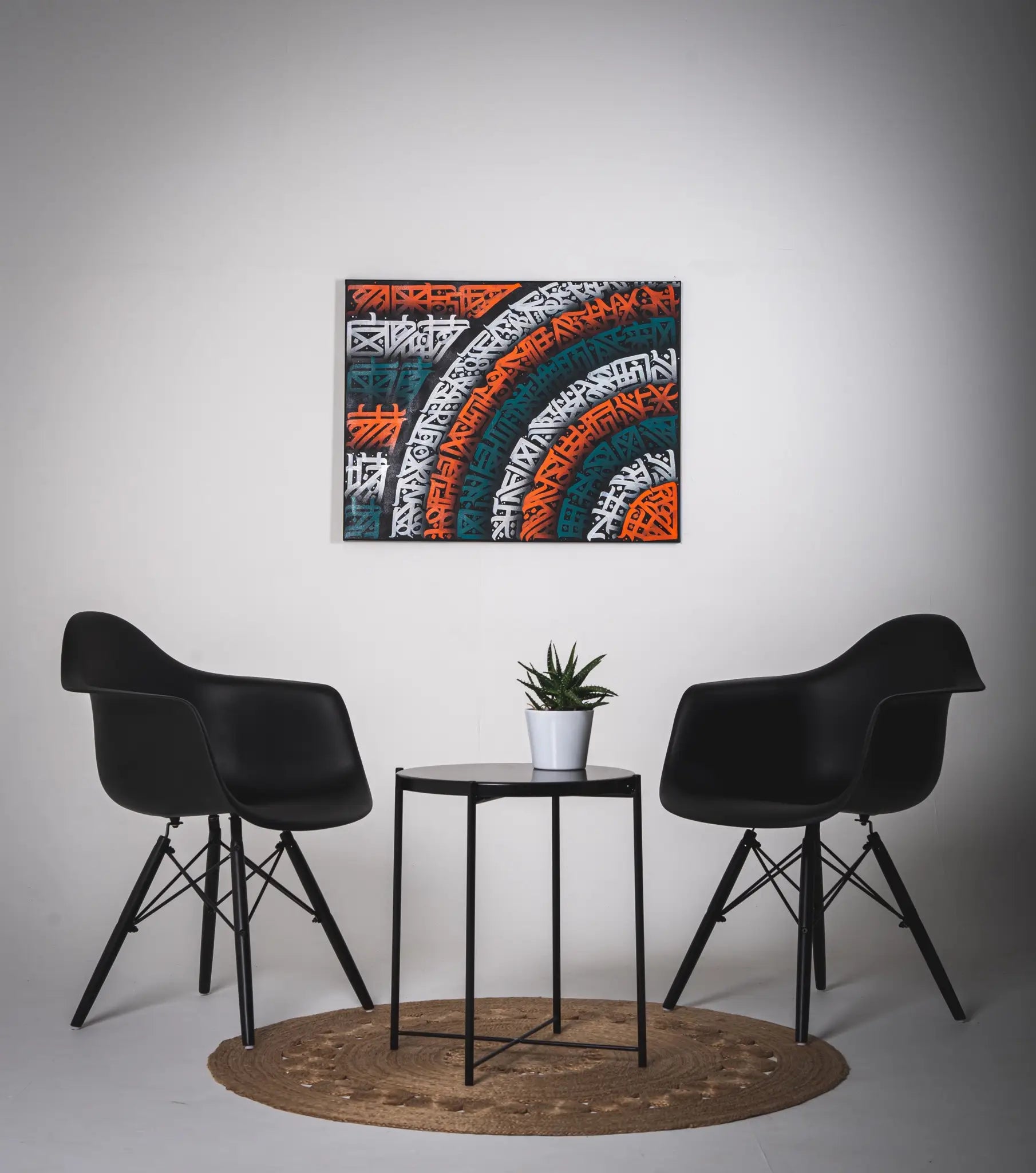 THE PIN WHEEL artwork displayed in a living room – demonstrating how its graceful movement and monochromatic contrast elevate any interior space.