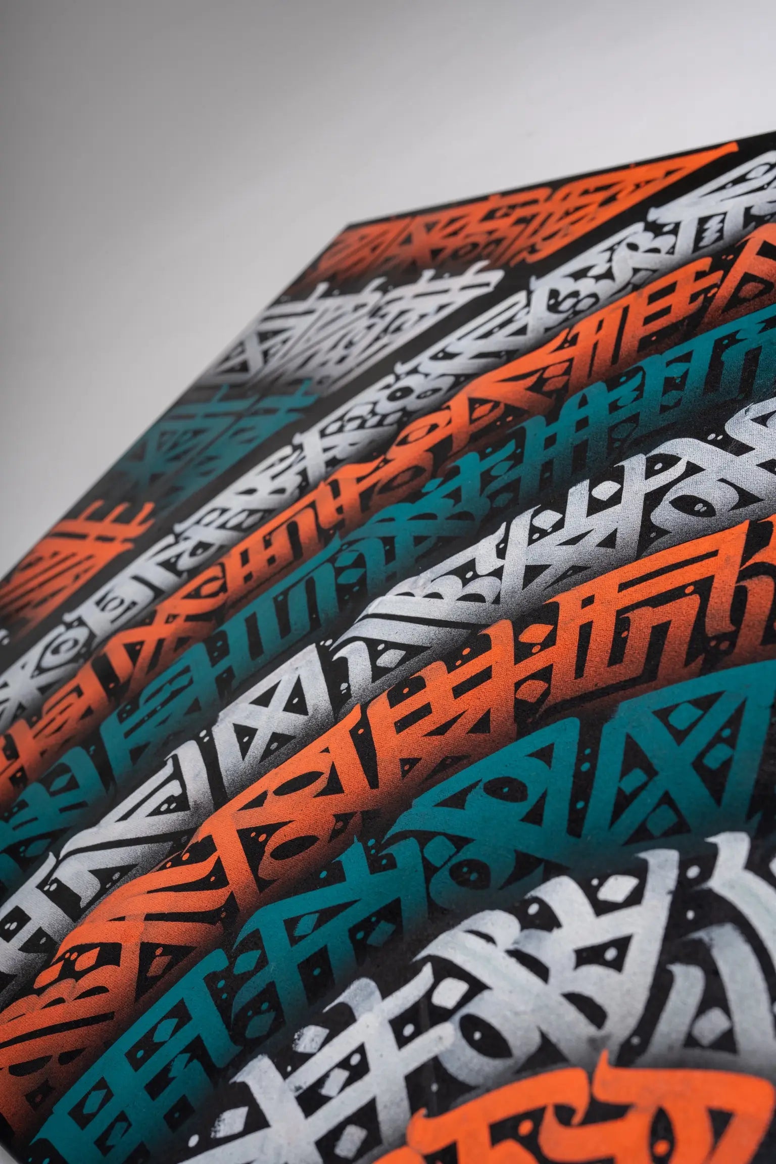 Third angled close-up of THE PIN WHEEL – capturing delicate transitions and layered textures in the swirling design.