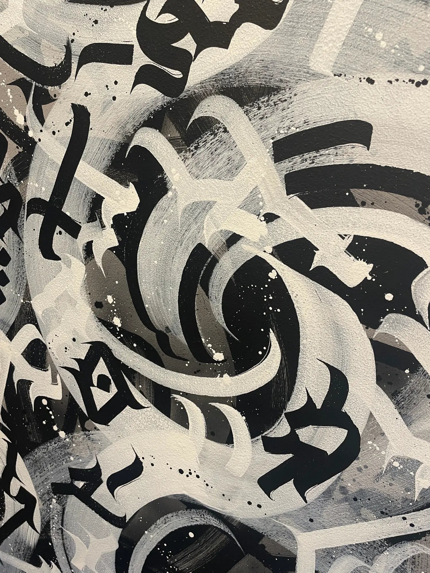 Detailed view of spray paint layers and textures on Chaos original artwork.