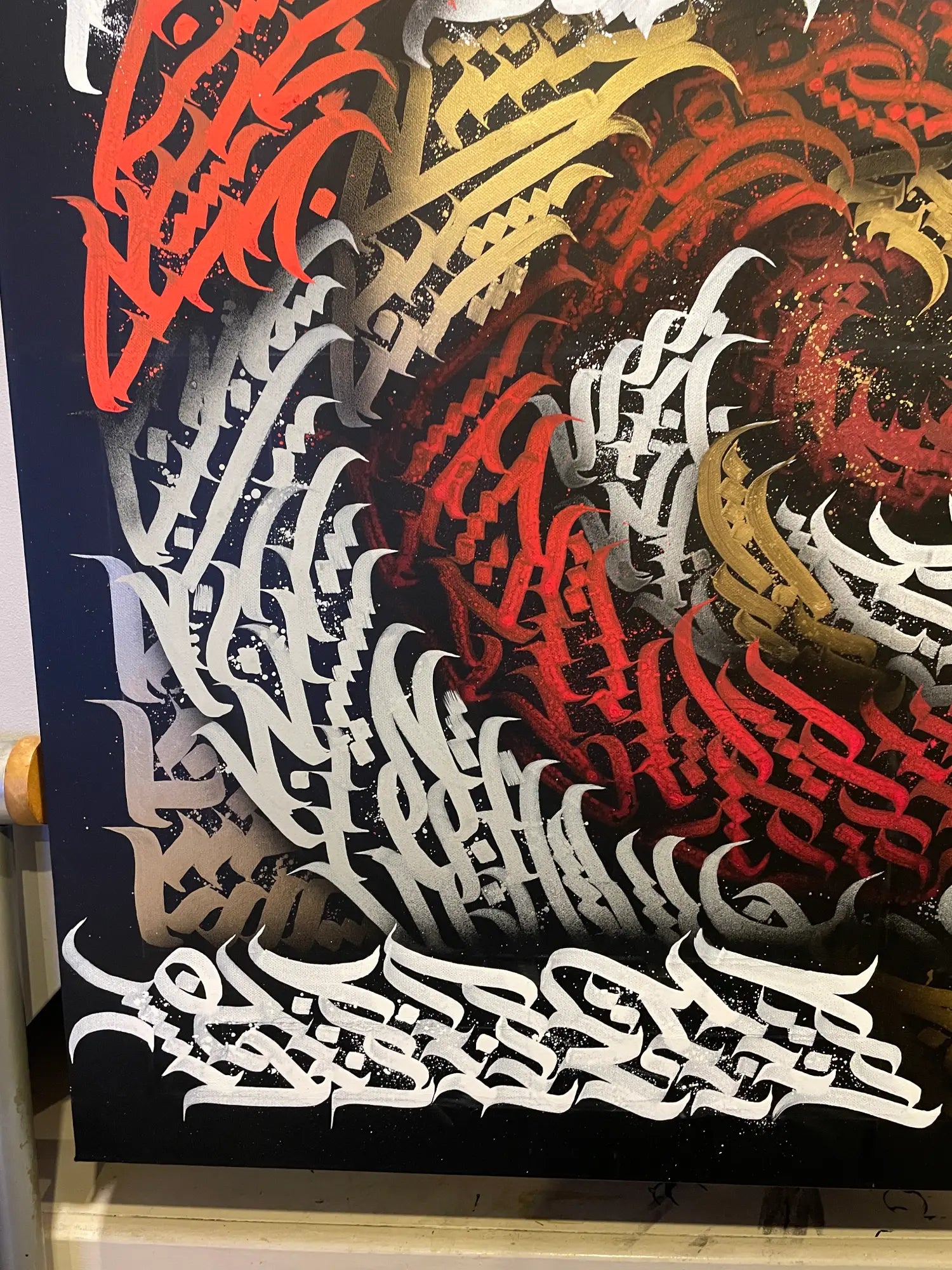 Burnzy art, Up in flames, Artistic depiction of calligraphy in red, gold, and white on a dark background