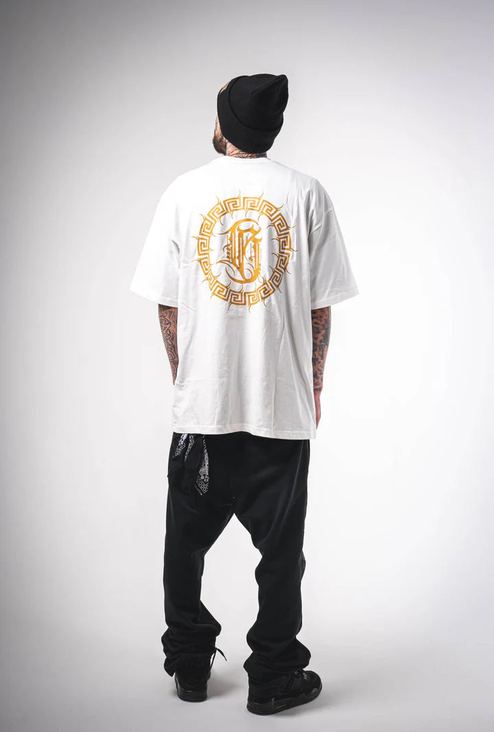 Rear view of a man wearing the Burnzy white calligraphy t-shirt, displaying the oversized fit and clean back.